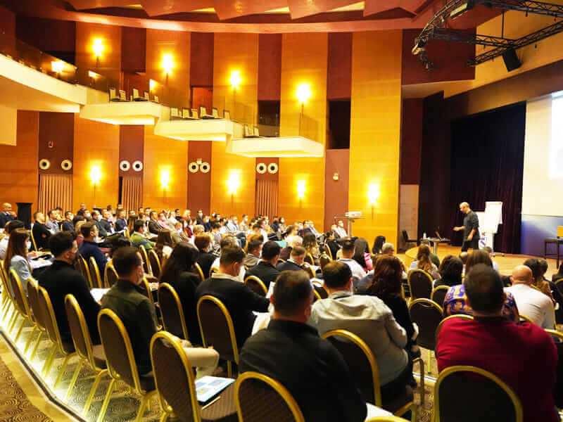 Taskin Koksalan leading an NLP training session for a corporate group
